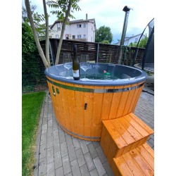 A pre-configured hot tub with accessories, delivered free of charge