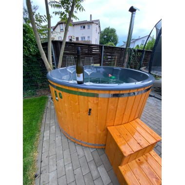 A pre-configured hot tub with accessories, delivered free of charge