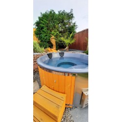 A pre-configured hot tub with accessories, delivered free of charge