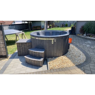 A pre-configured hot tub with accessories, delivered free of charge